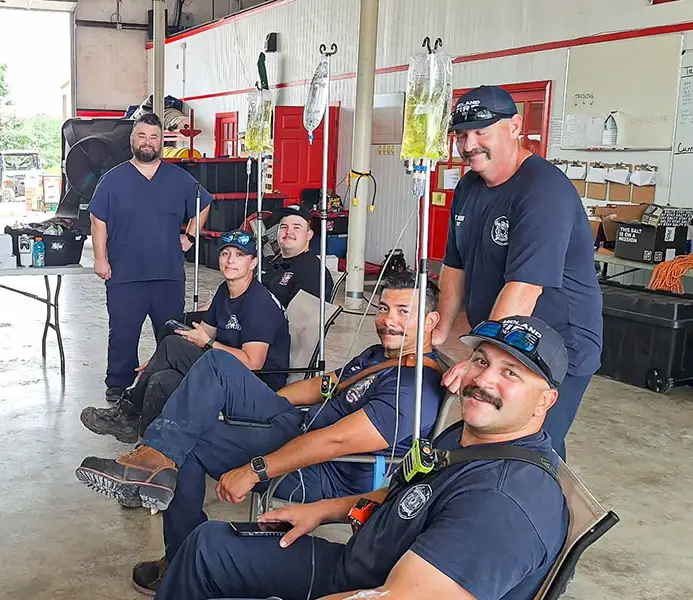 Firefighters receiving IV Therapy