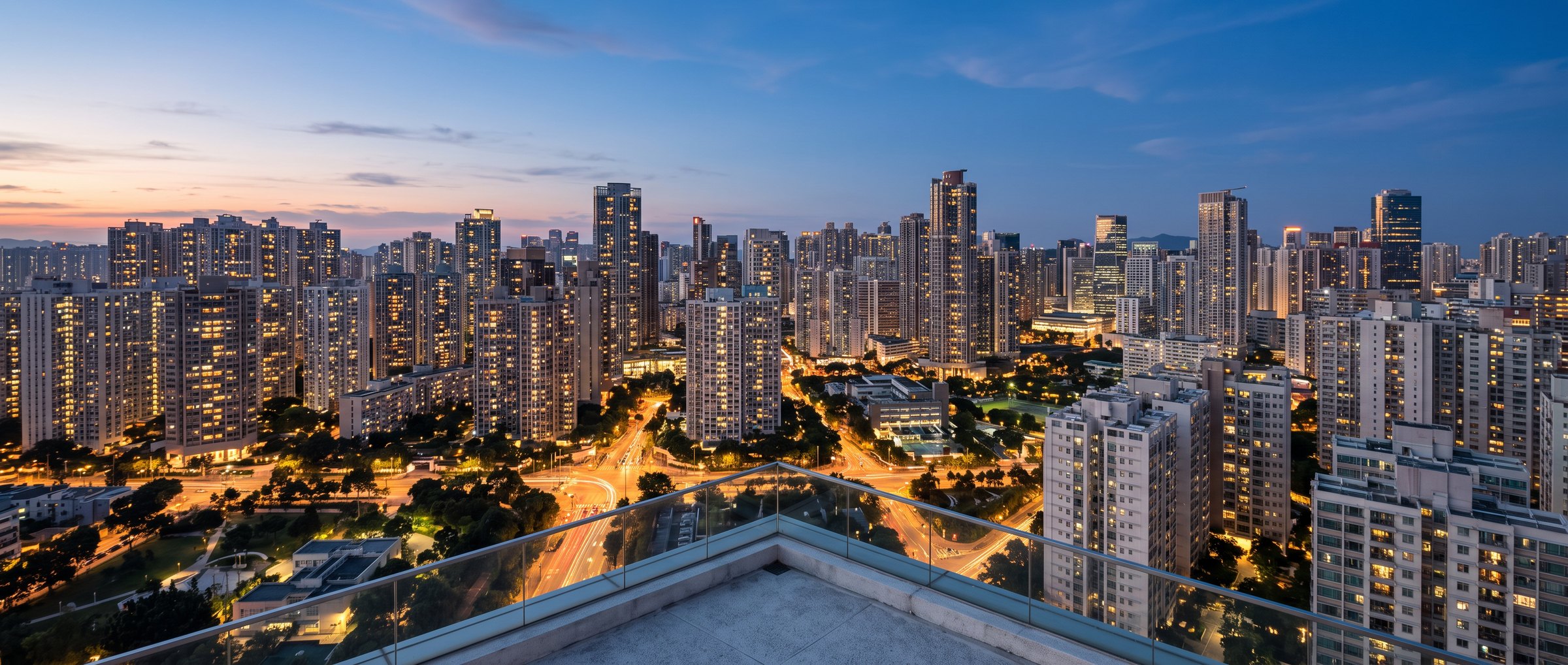 A city skyline at dusk seen from a rooftop terrace