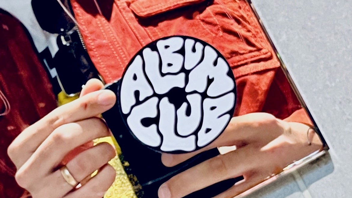 Photo of Album Club Logo on a Sticker