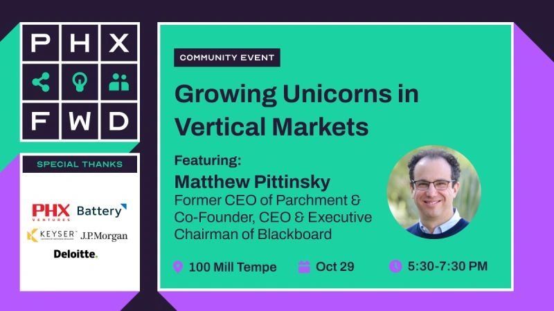 a black and white living room with a large tv