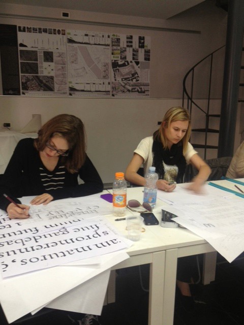 students working on lettering