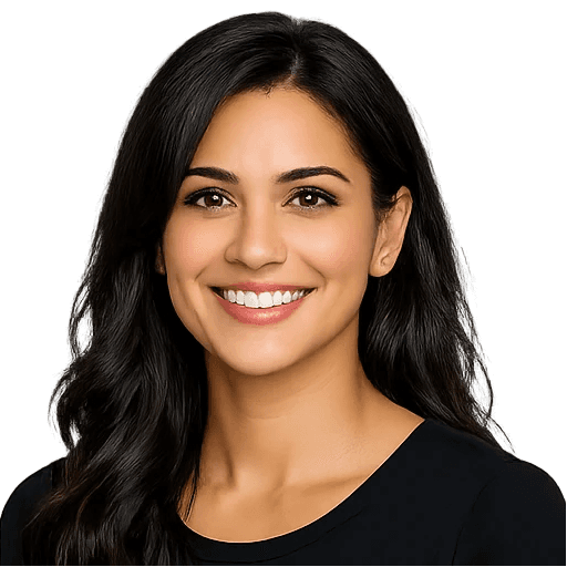 Portrait of a smiling woman with long dark hair against a light background.