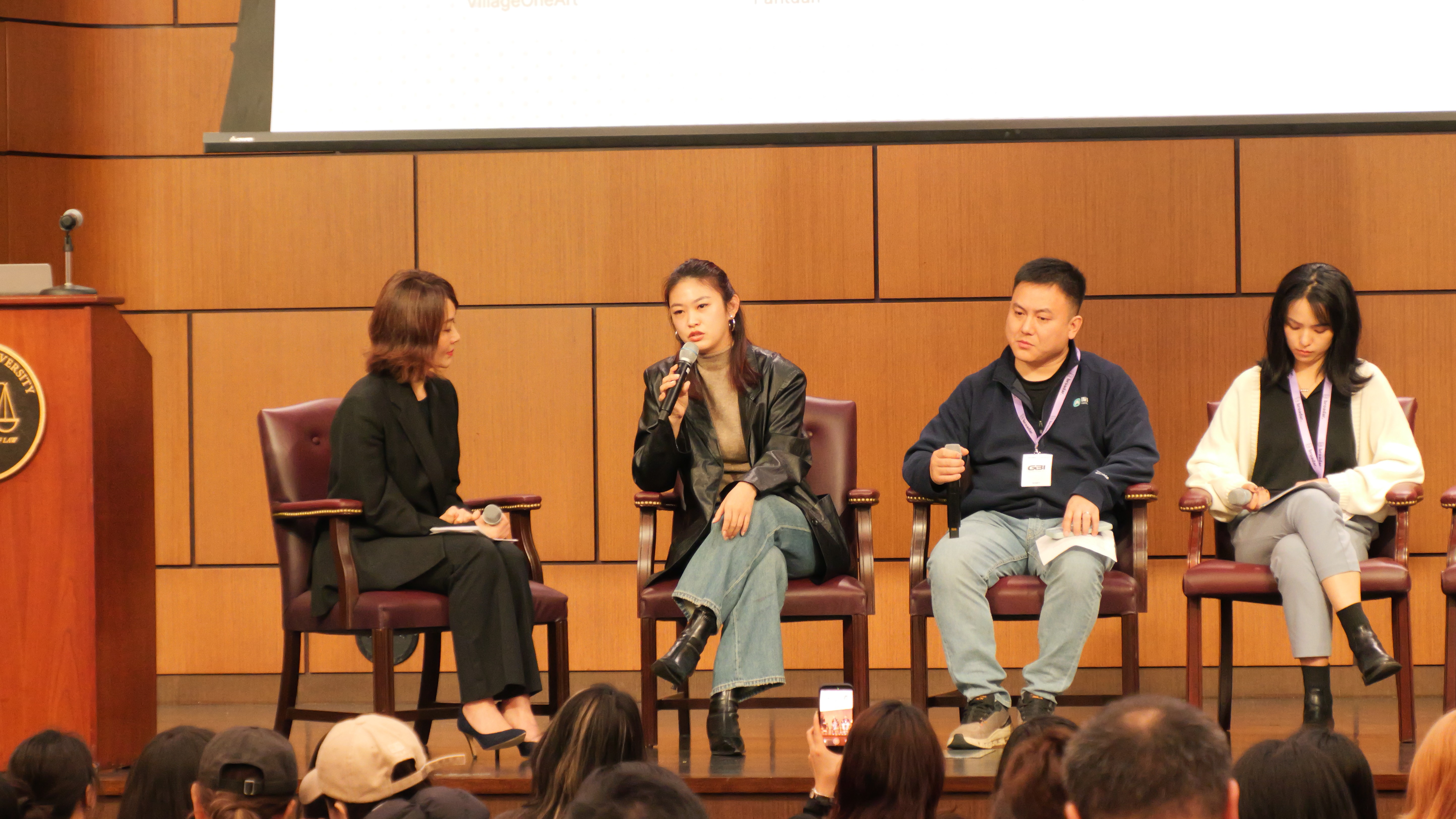 Three children walk along a dirt path.