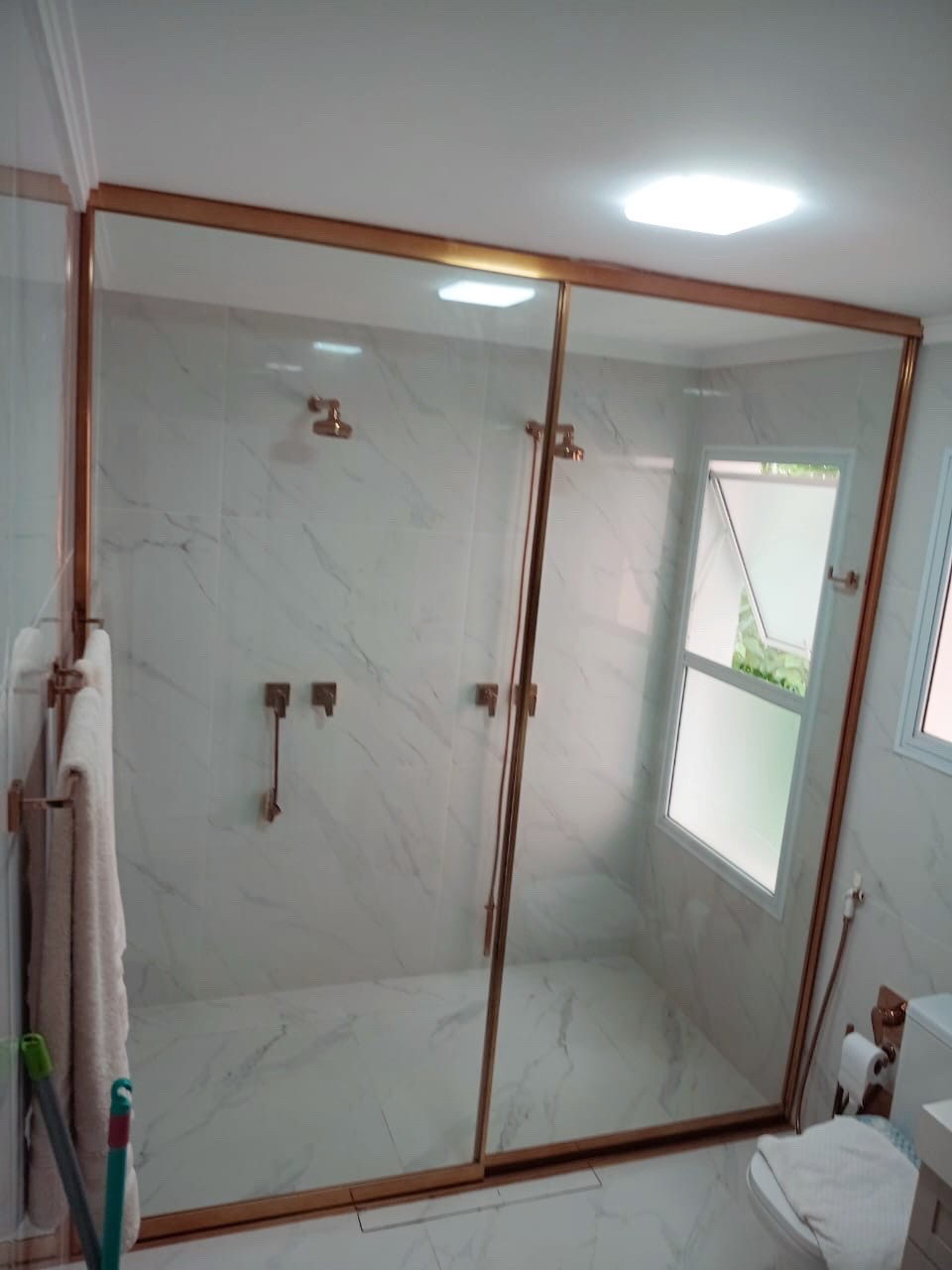 man wearing gray polo shirt beside dry-erase board