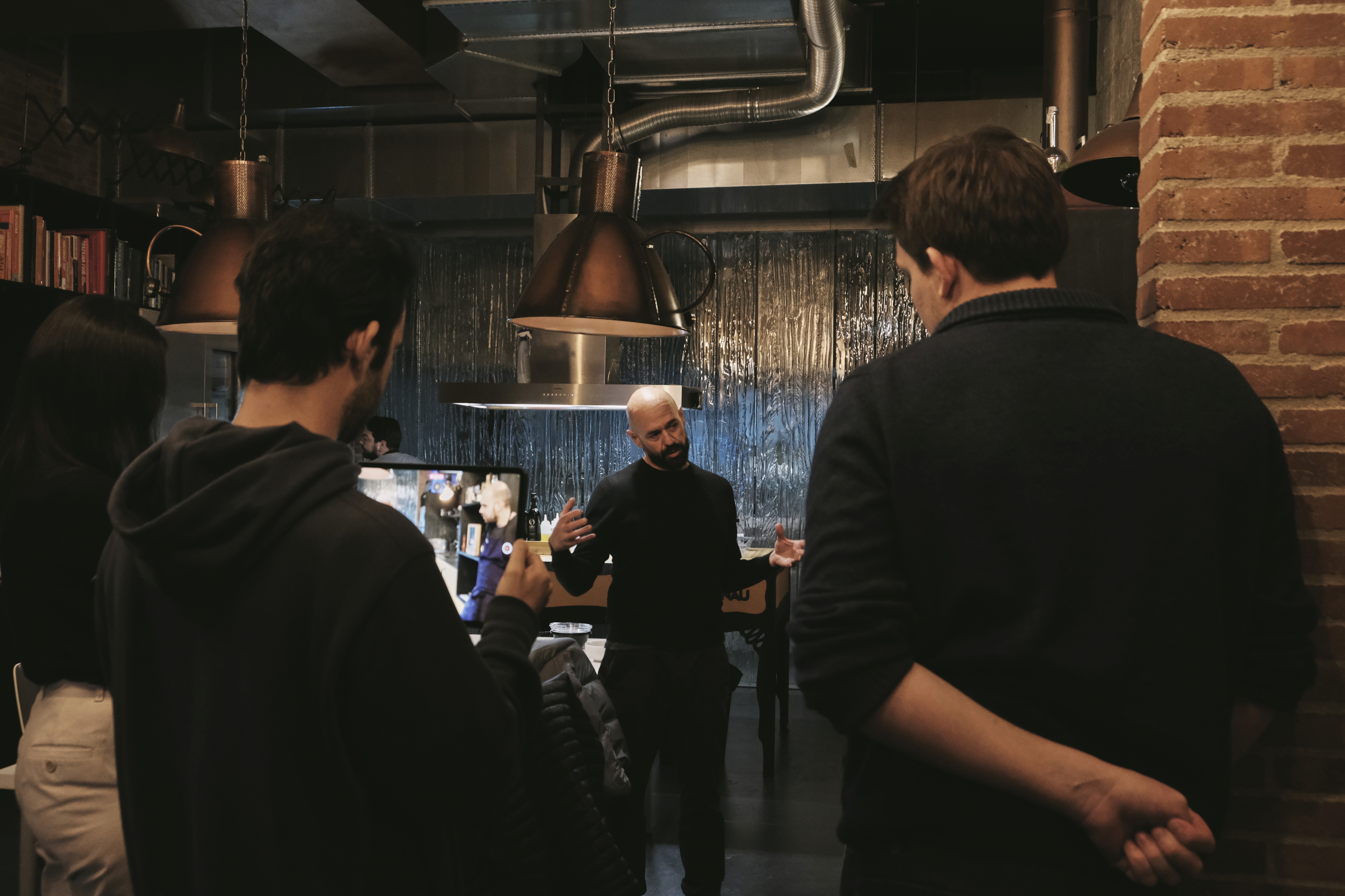 Person in a white off-shoulder top using a MacBook laptop, with text overlay 'What's new in digital?' and the fabrica® logo in the top corner.