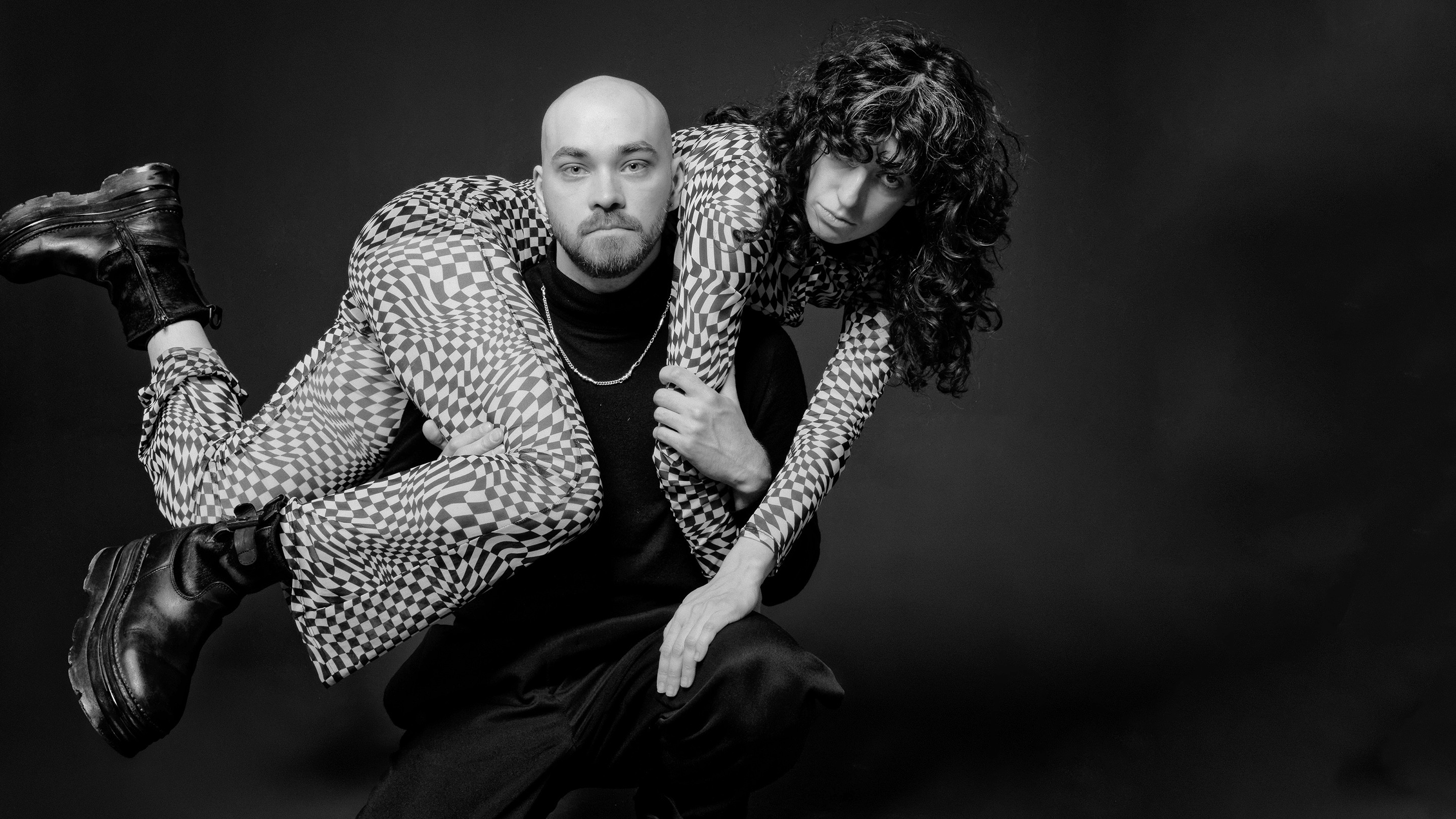 Man carrying a woman on his shoulders 