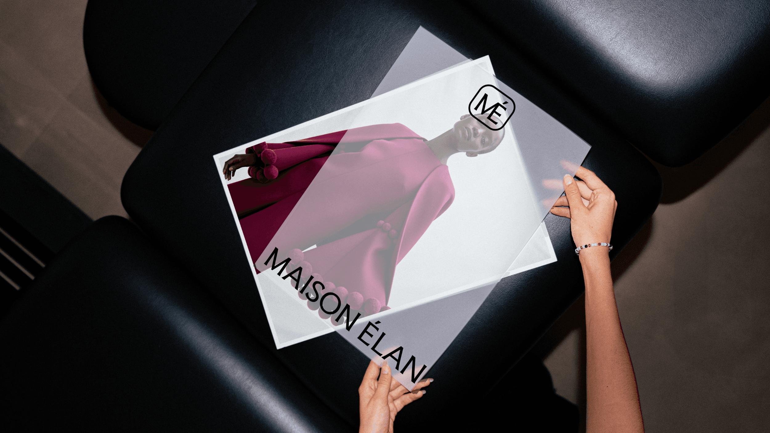 A Maison Élan poster featuring a woman wearing a burgandy outfit.