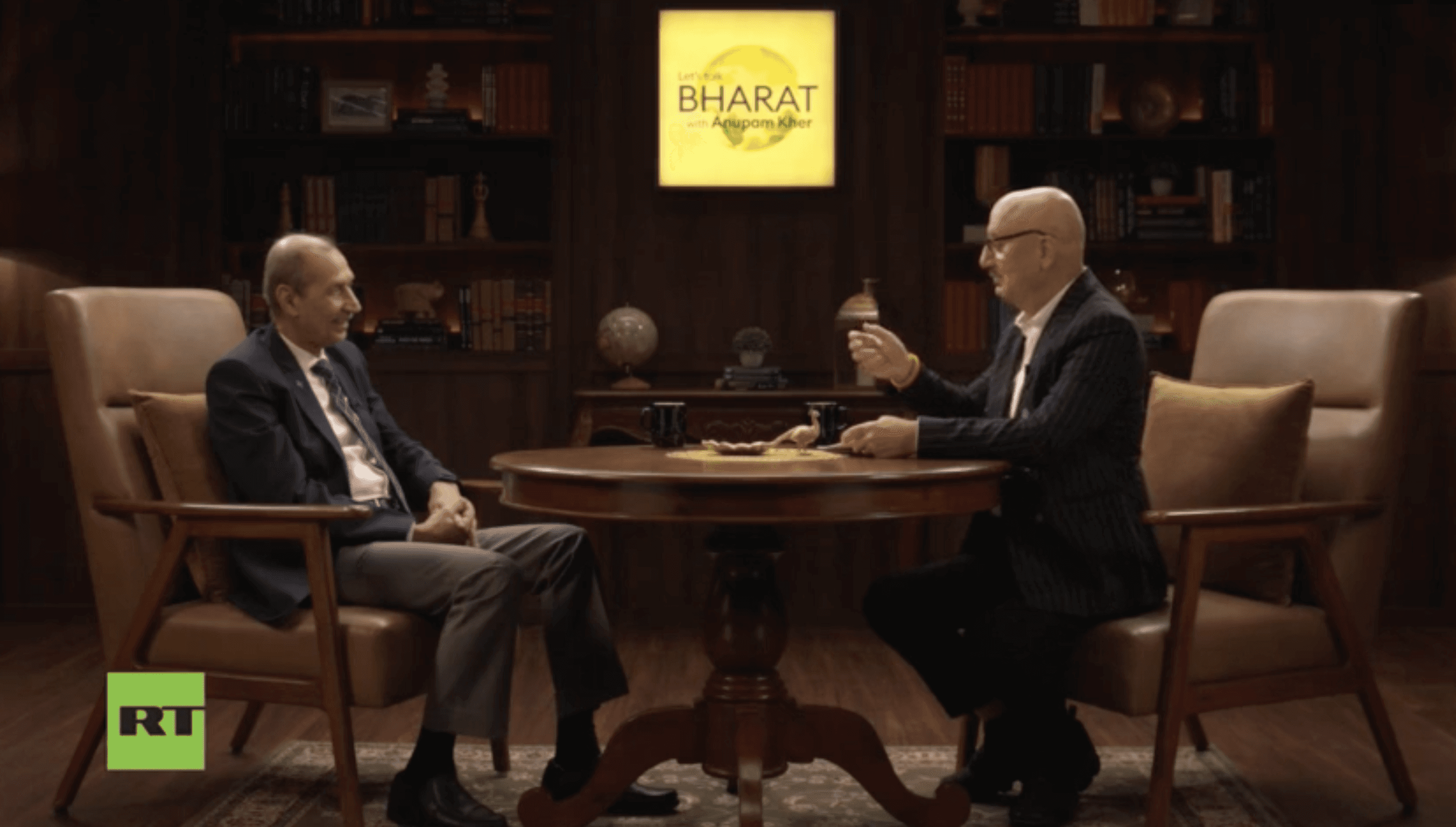 Barbed wire fence along a dry, overgrown path.