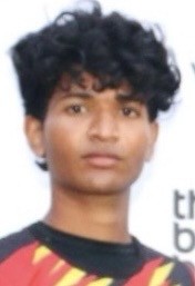 man in gray crew neck t-shirt and gray shorts sitting on basketball court