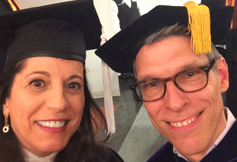 A photo of two freshly grad students.