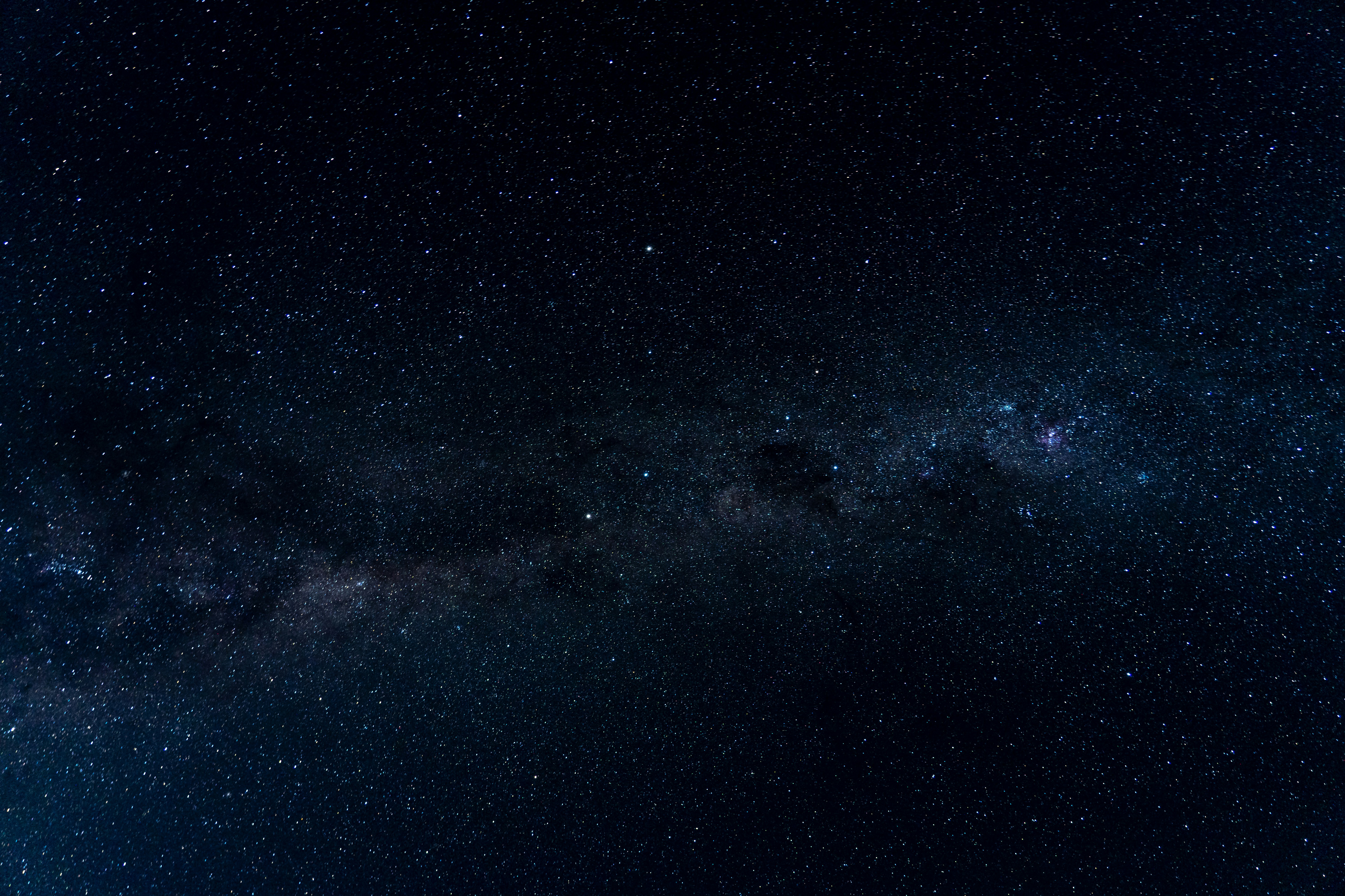 blue and black starry night sky