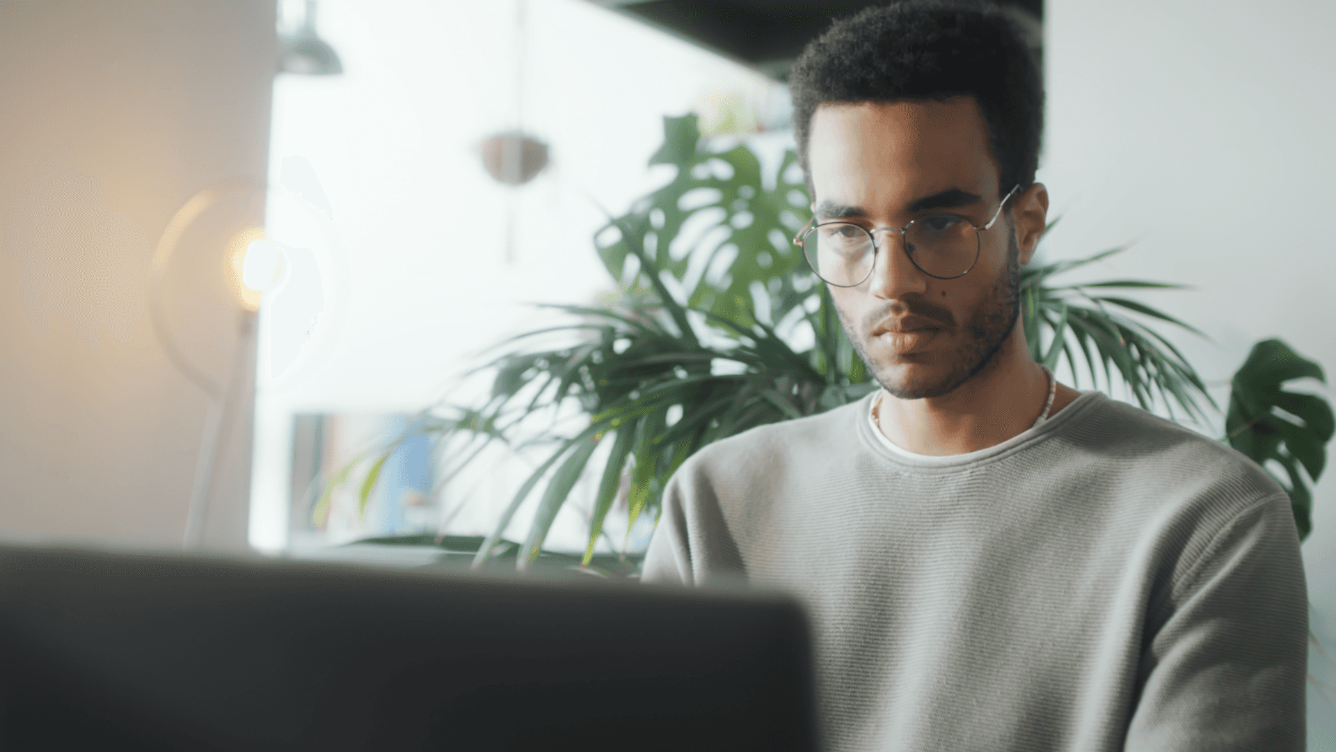 A man working on his laptop.