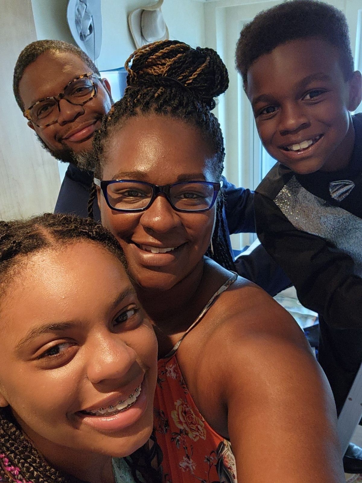 Group selfie of family of 4