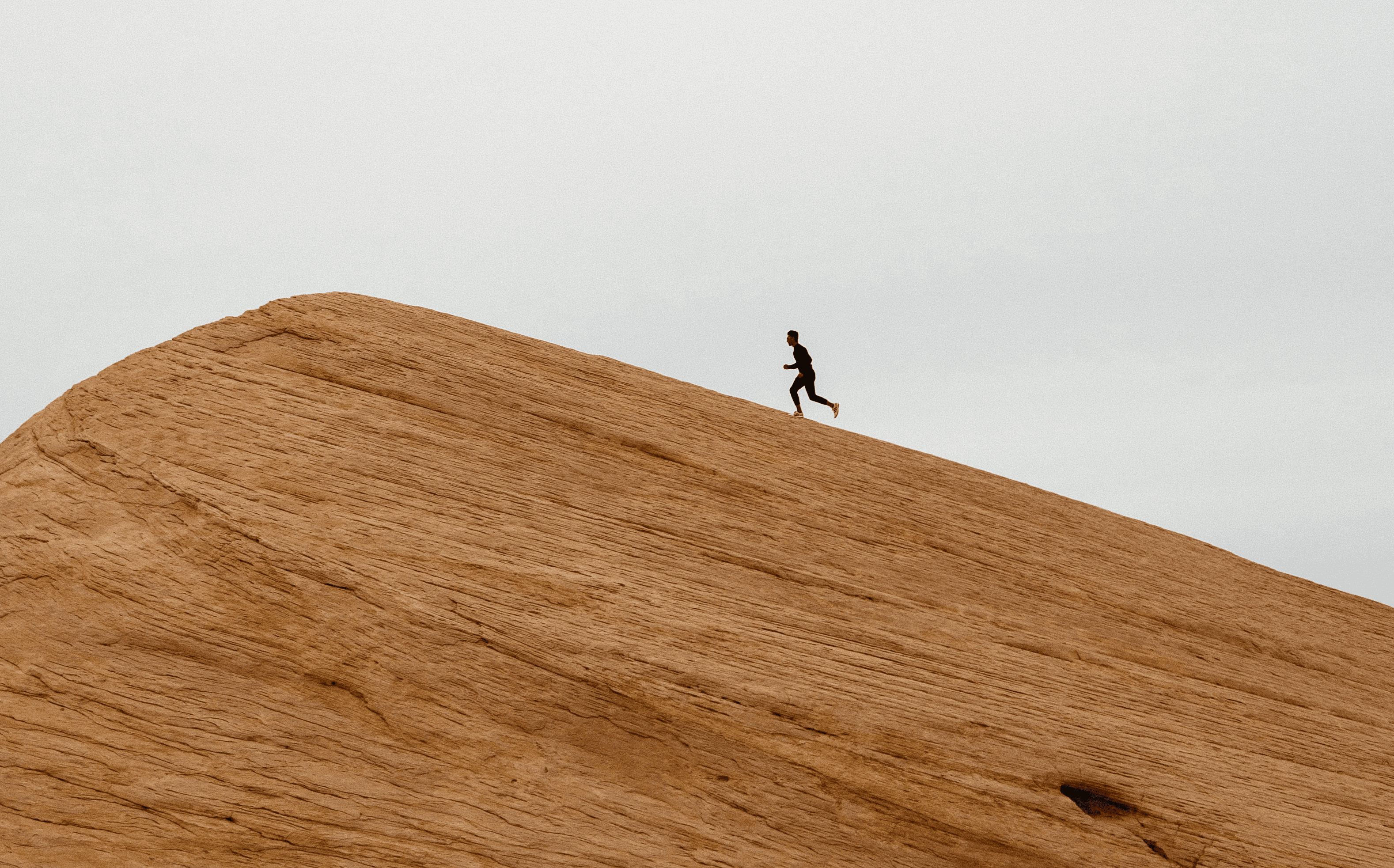 A woman jogging on a road