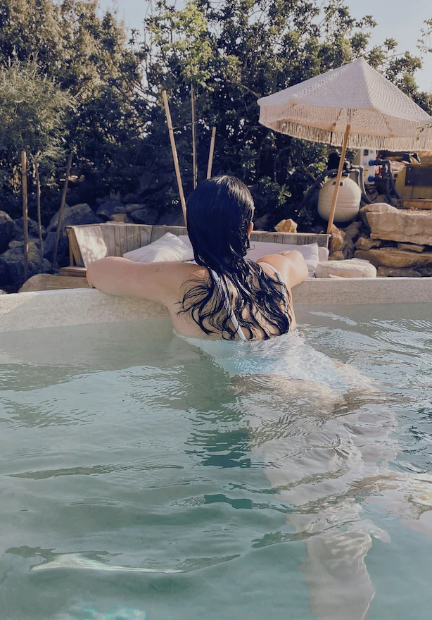 Calm woman relaxing in an outdoor pool
