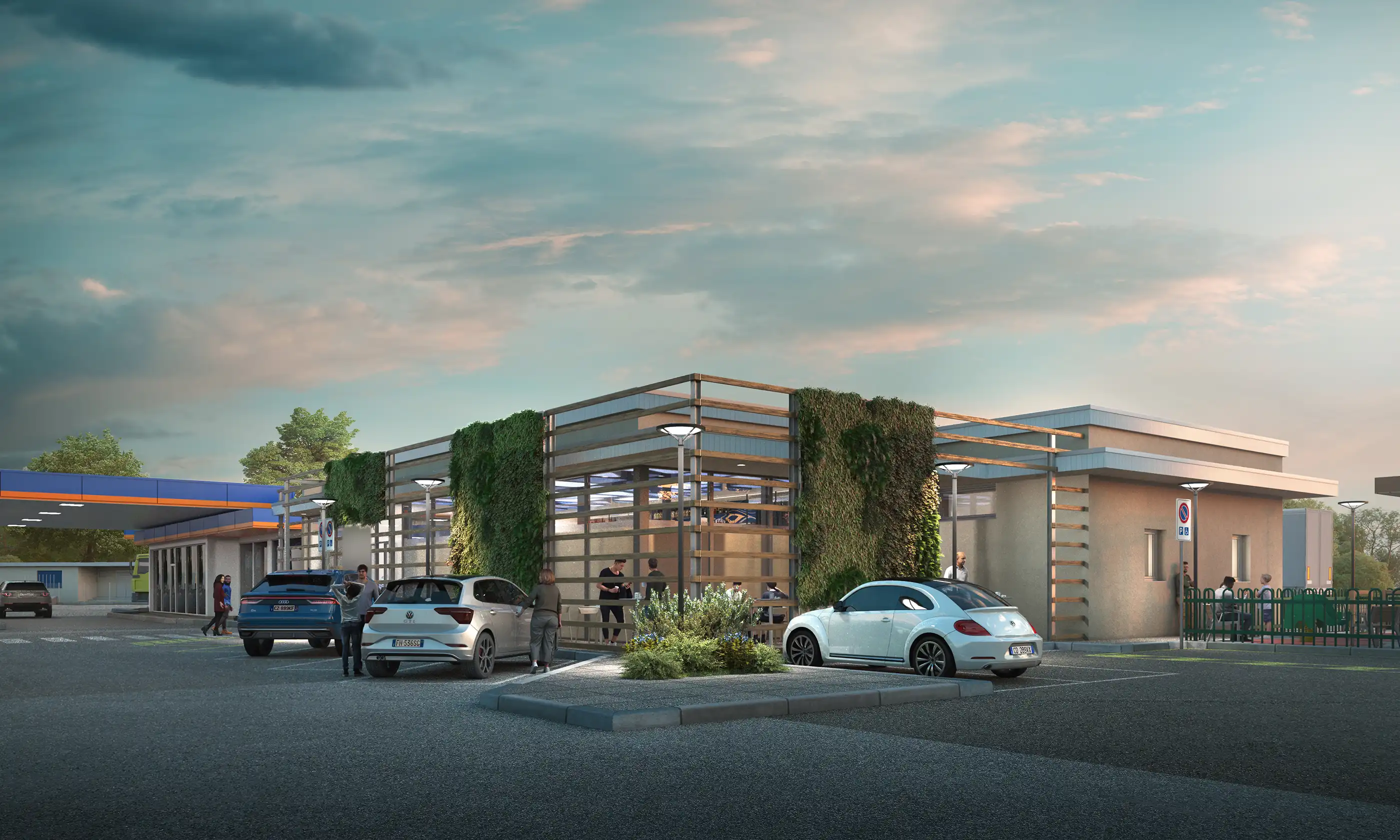 Contemporary service station complex at dusk with green vertical gardens, outdoor seating, and parked cars including Volkswagen models. Modern retail and fuel station design.