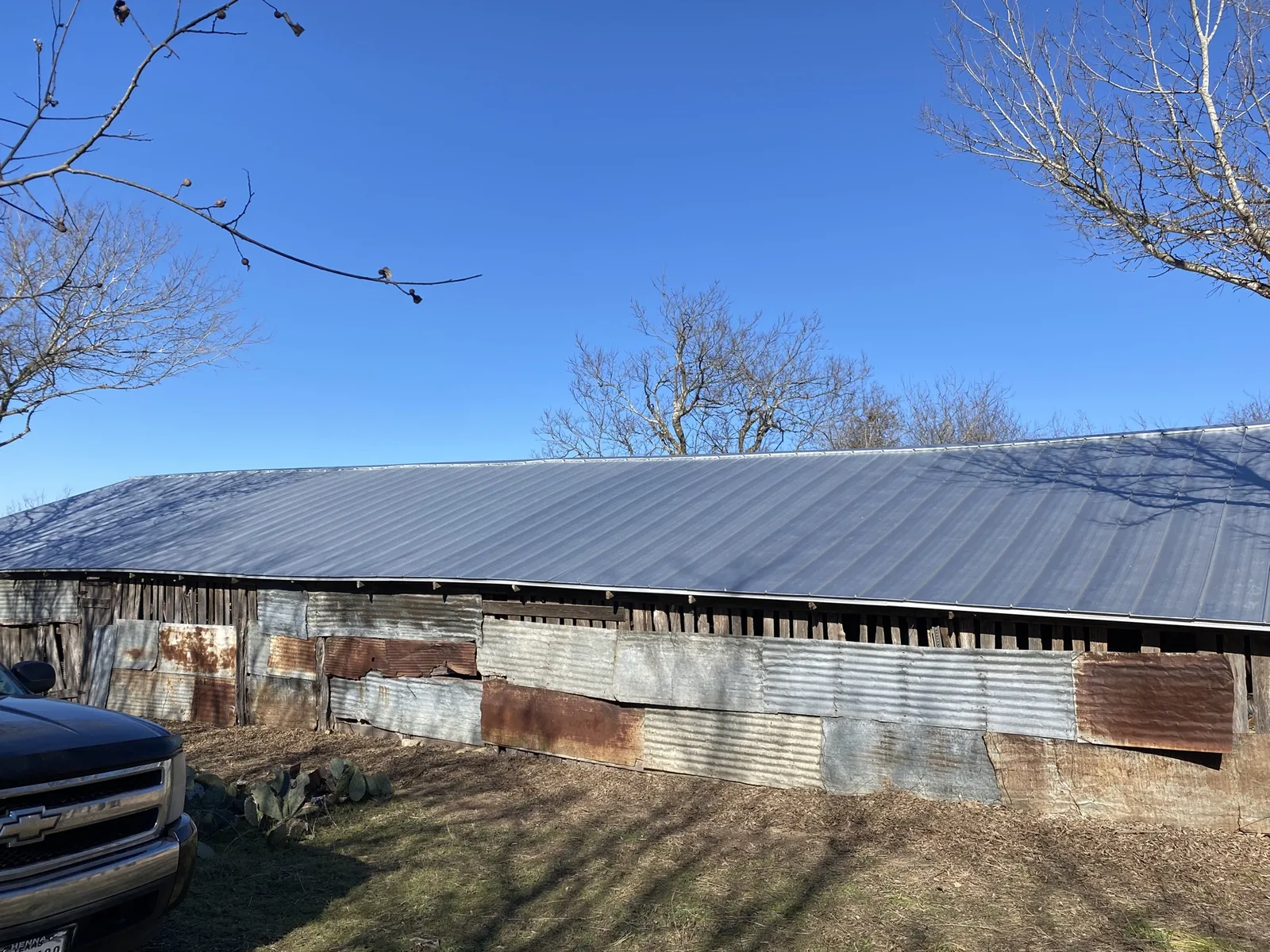 After - another angle: a new metal roof for a barn.