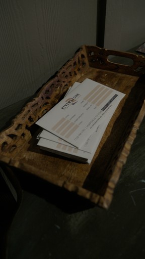 a woman standing in front of a crowd holding a microphone