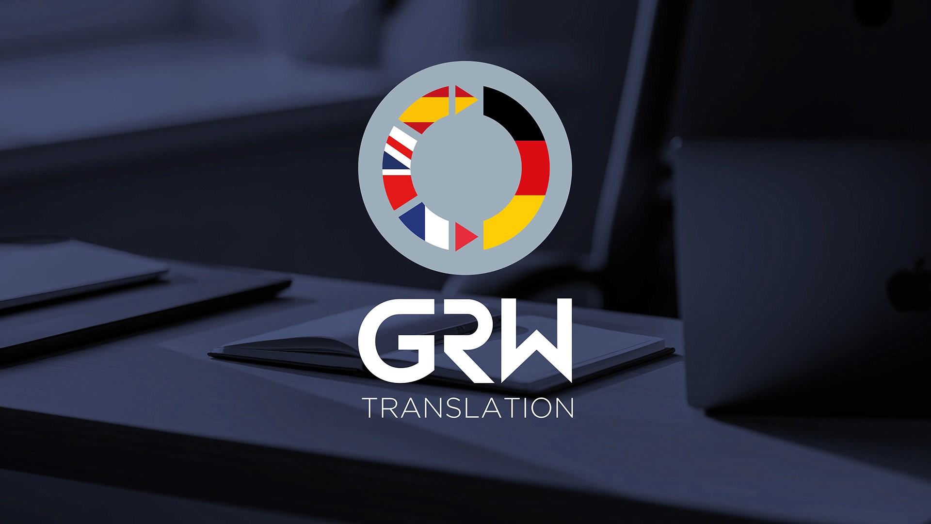 GRW Translation logo and brand identity design on desk background by Huw Mathias graphic designer London