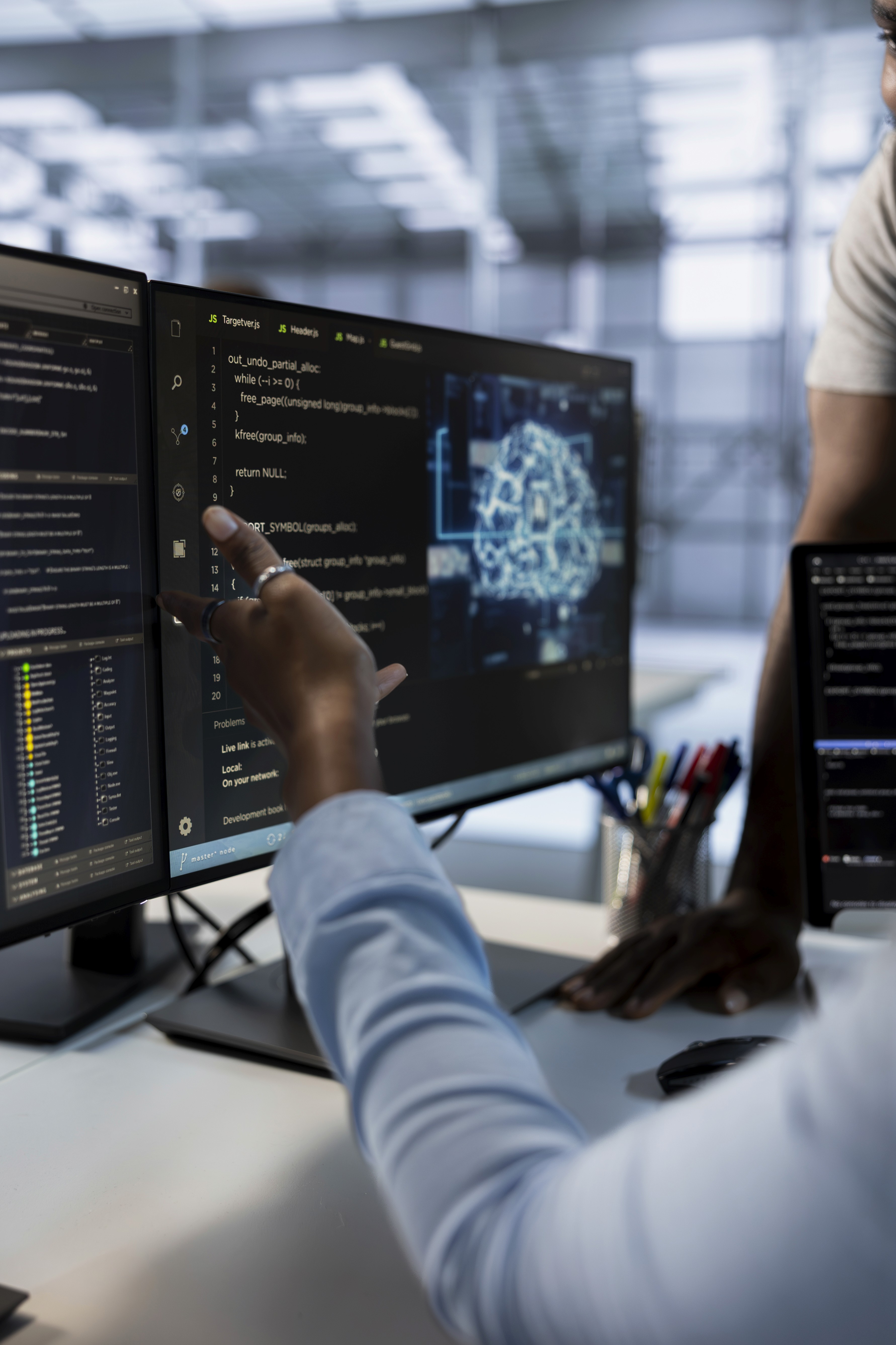 woman sitting around table holding tablet