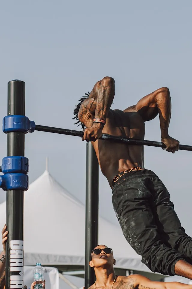 Athlete gripping a bar during strength training, preparing for the next lift