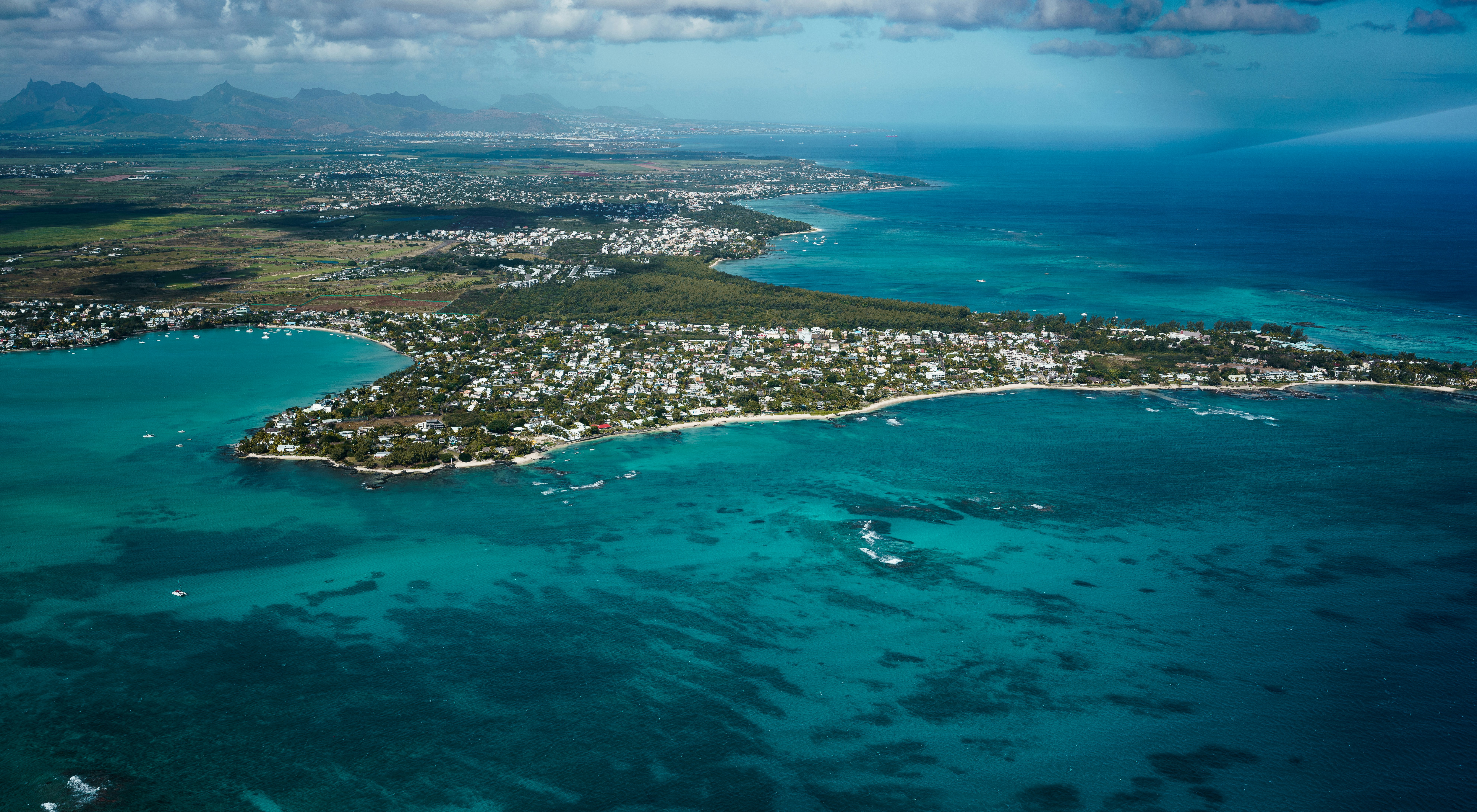 an aerial view of an island in the middle of the ocean