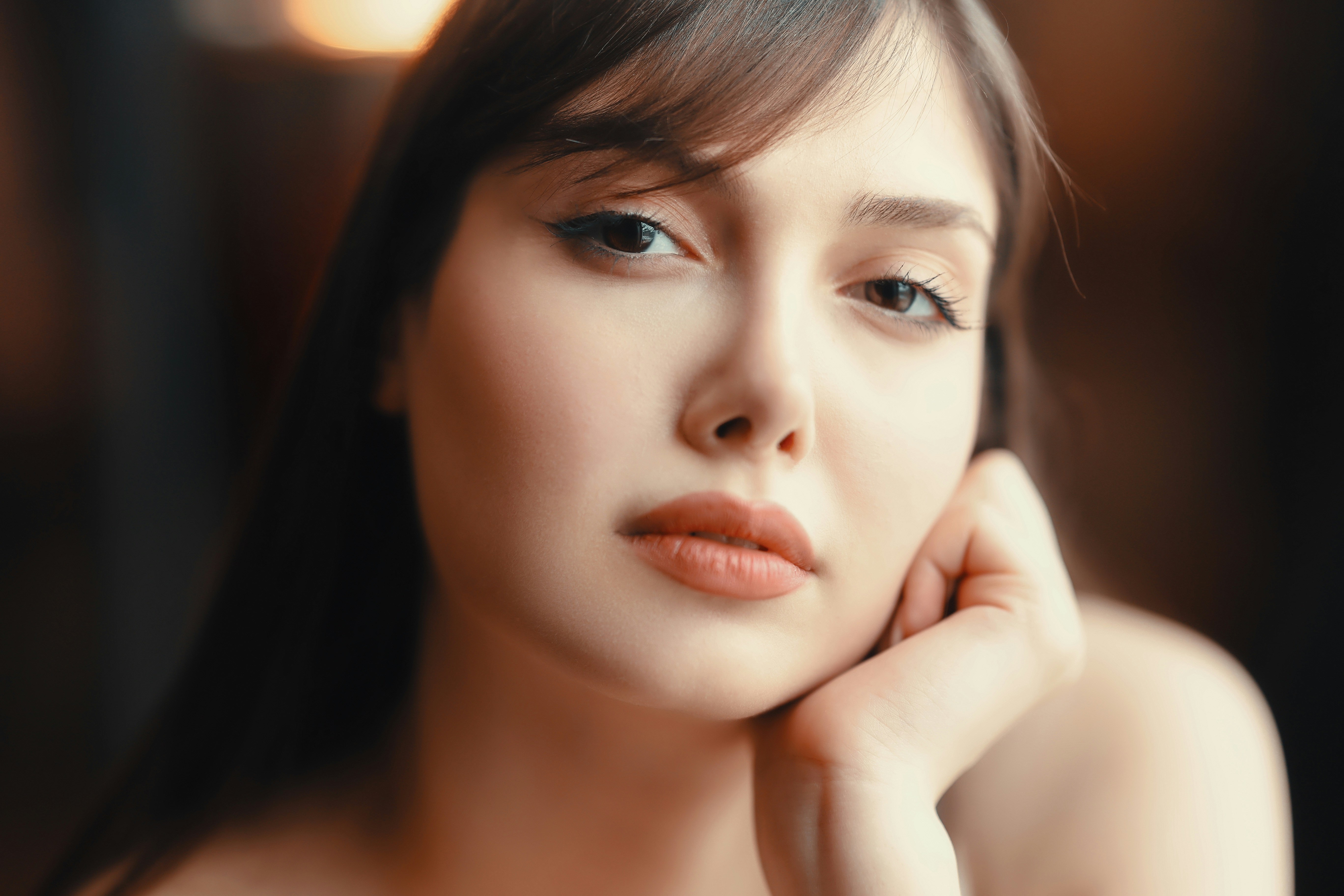 Woman posing to camera holding her chin