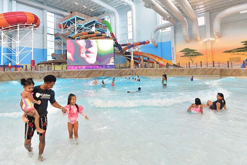 Family enjoying the large wave pool at Kalahari waterpark resor, Round Rock, Texas