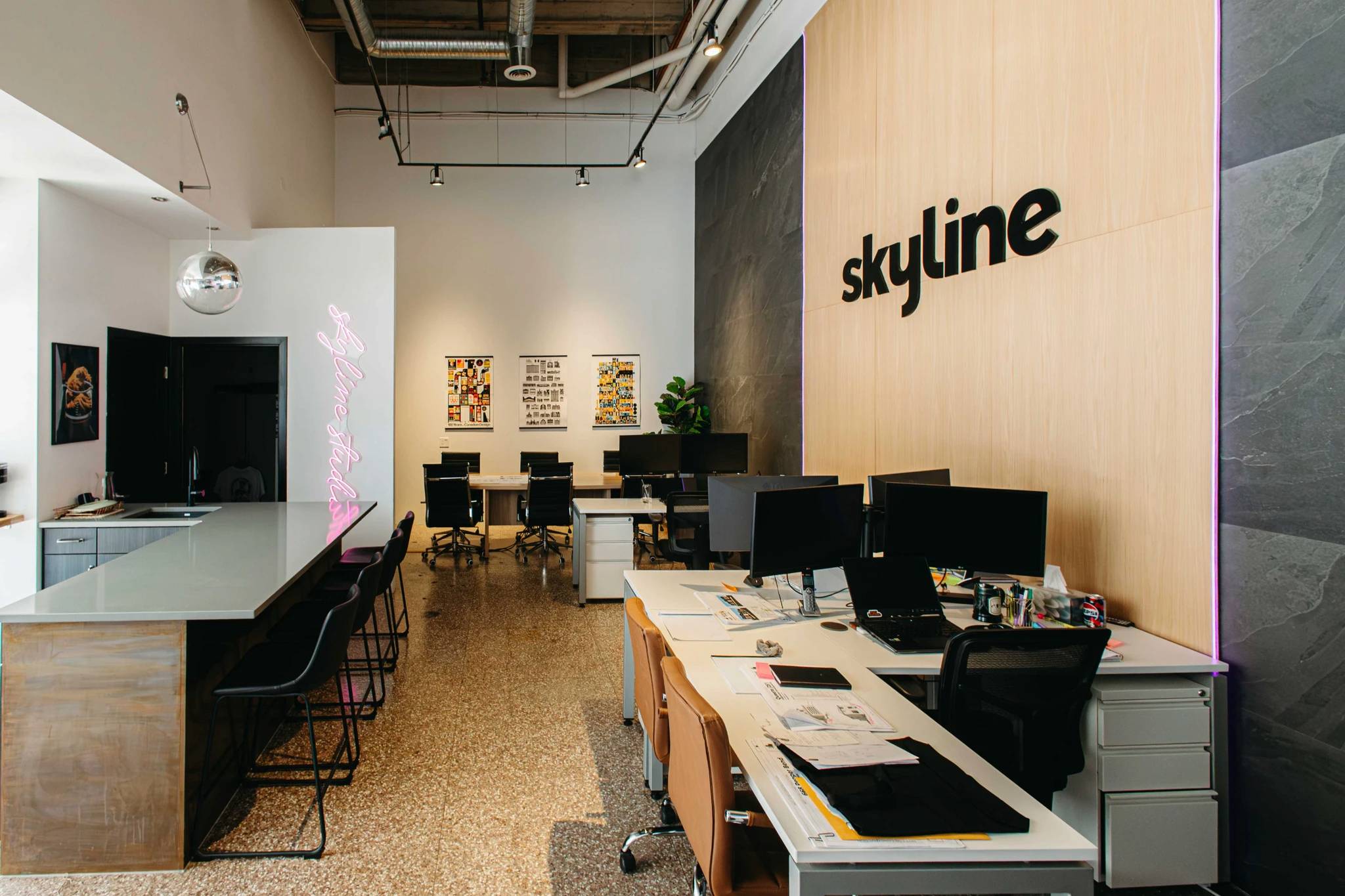 Saskatoon business rennovation after image showcasing a feature wall in a bright workspace