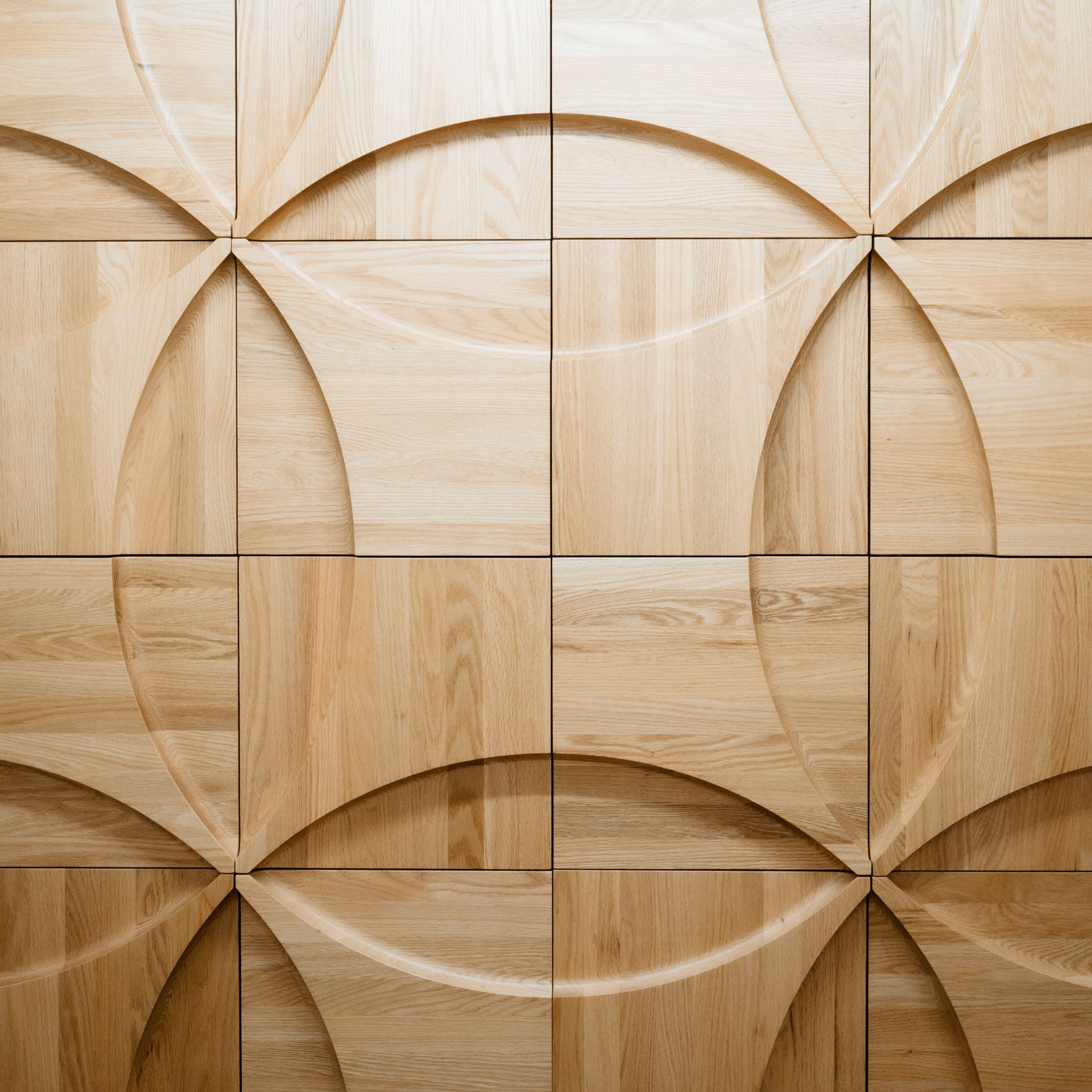 A fast black sports car races down the highway.