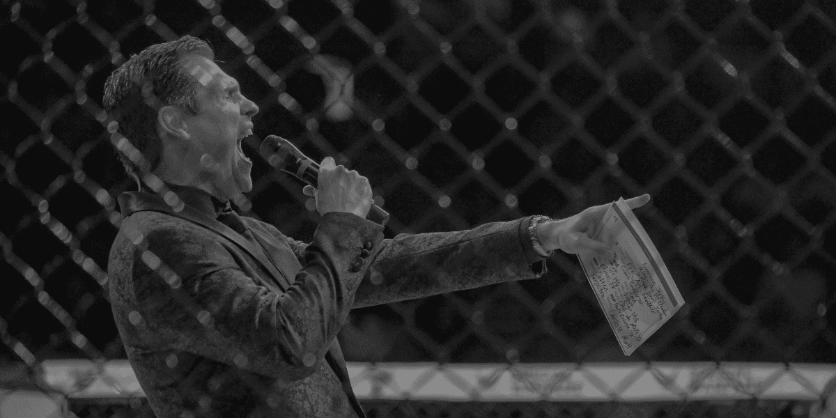 Chad Fishburne, renowned MMA ring announcer, delivering a powerful introduction at PFC 50, showcasing his commanding presence and professionalism.
