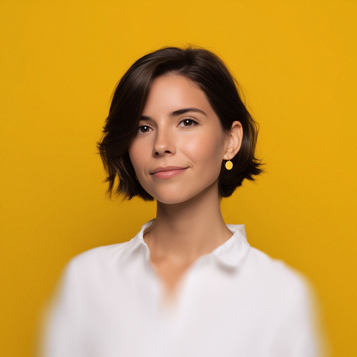 Team member portrait on yellow background