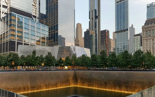 Ground Zero tour group at 9/11 Memorial near museum entrance, New York City.
