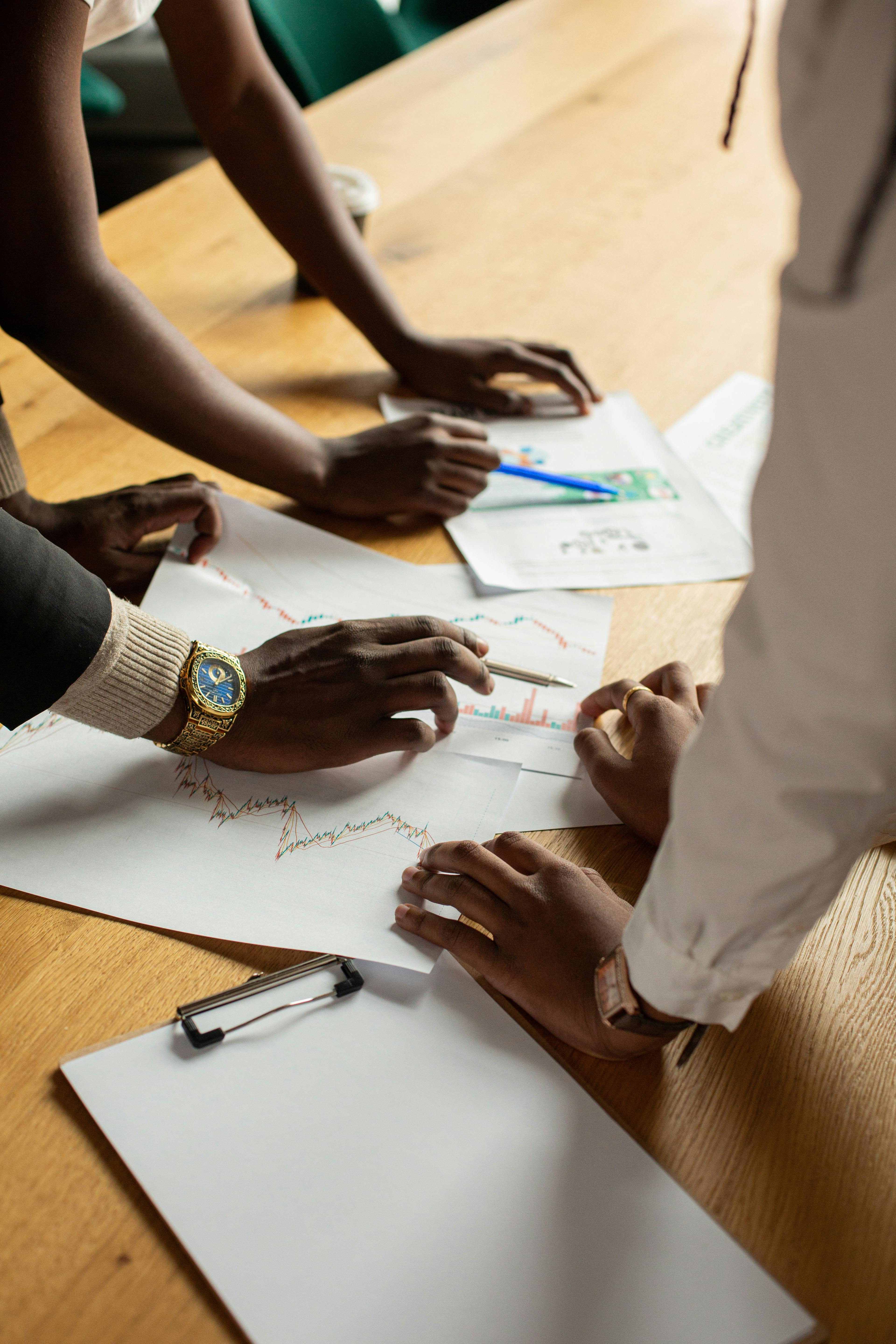 Four business professionals collaborating in a modern office space.