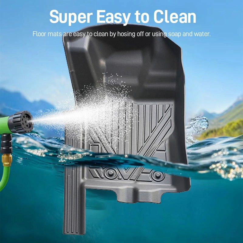 Black TPE car floor mat with raised channels, repelling water spray