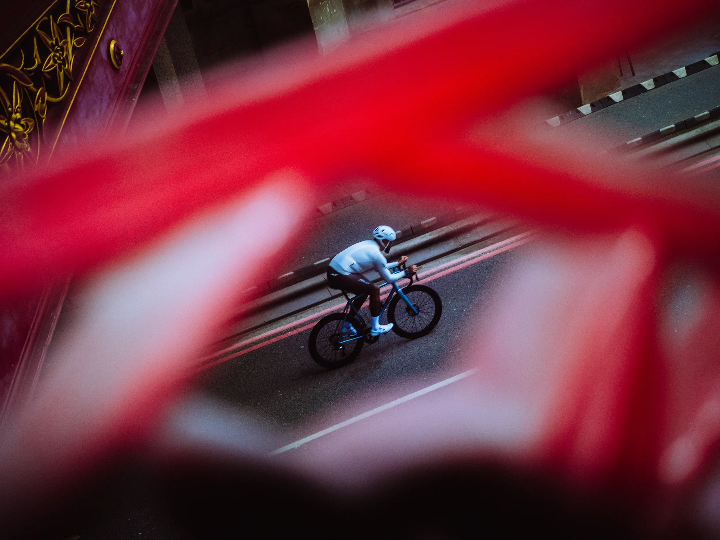 Cyclist riding a Quirk Cycles Durmitor road bike under a bridge in central London. Sports and fitness.