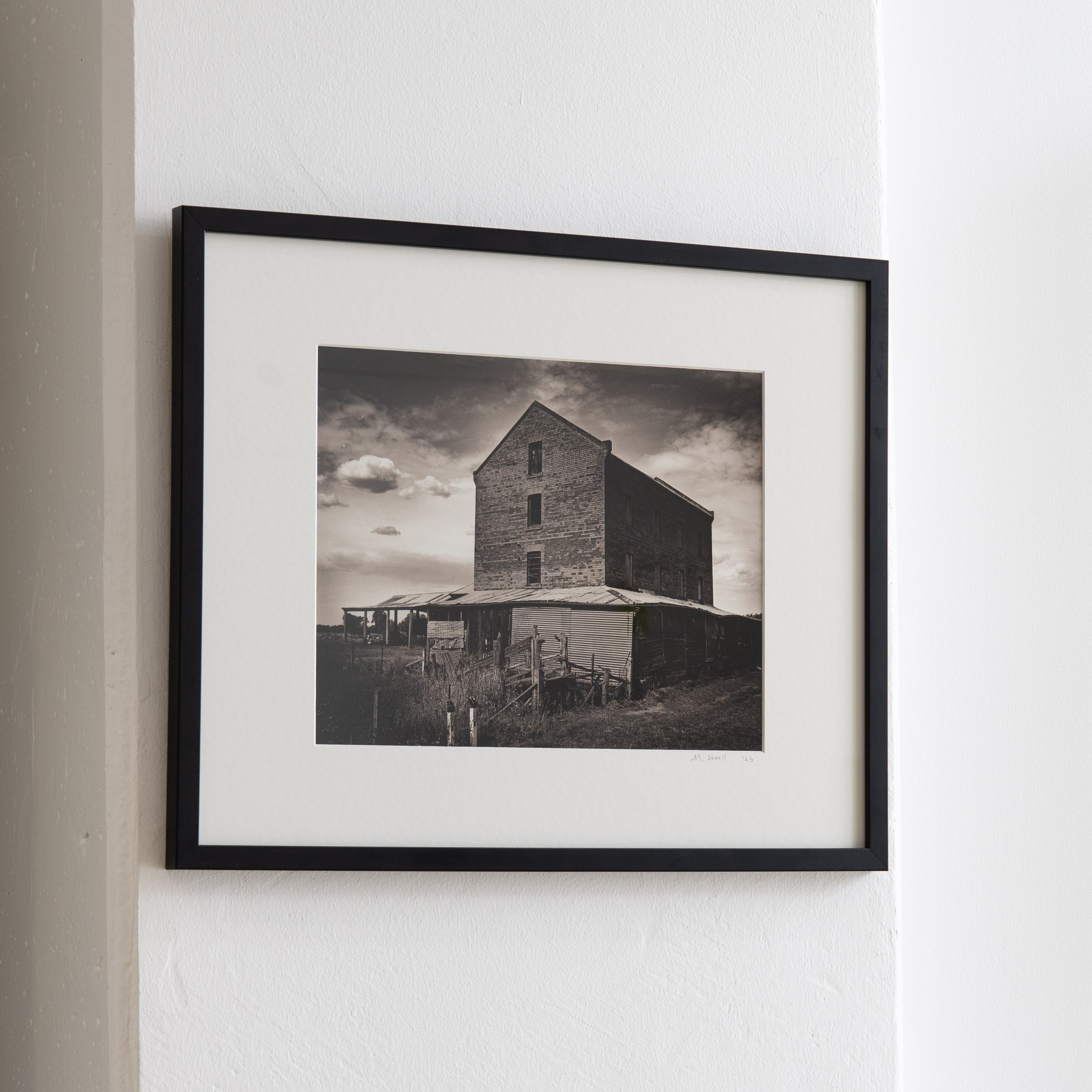 Darkroom prints drying on wire racks