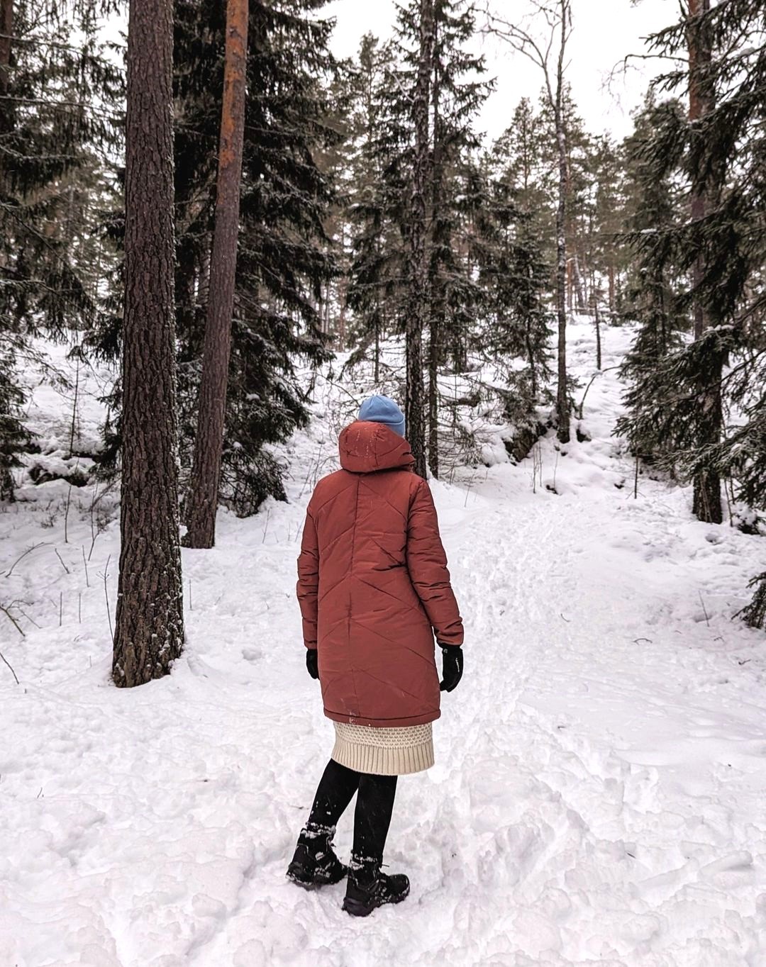 Annika in a snowy Swedish forest.