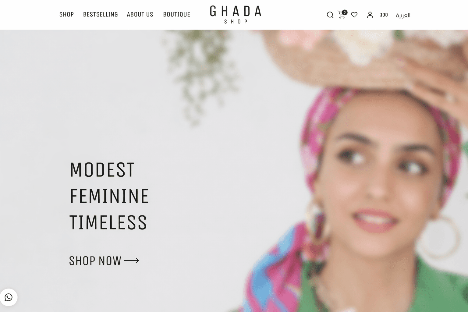 Hero section of Ghada Shop fashion e-commerce website featuring a modest fashion model and the tagline “Modest, Feminine, Timeless.”