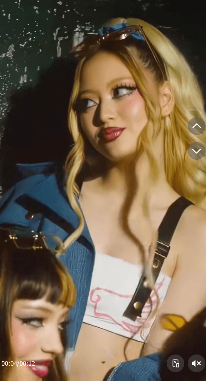 Kendall Ebeling of GIRLSET with blonde and dark hair wearing Y2K-style makeup and outfits.