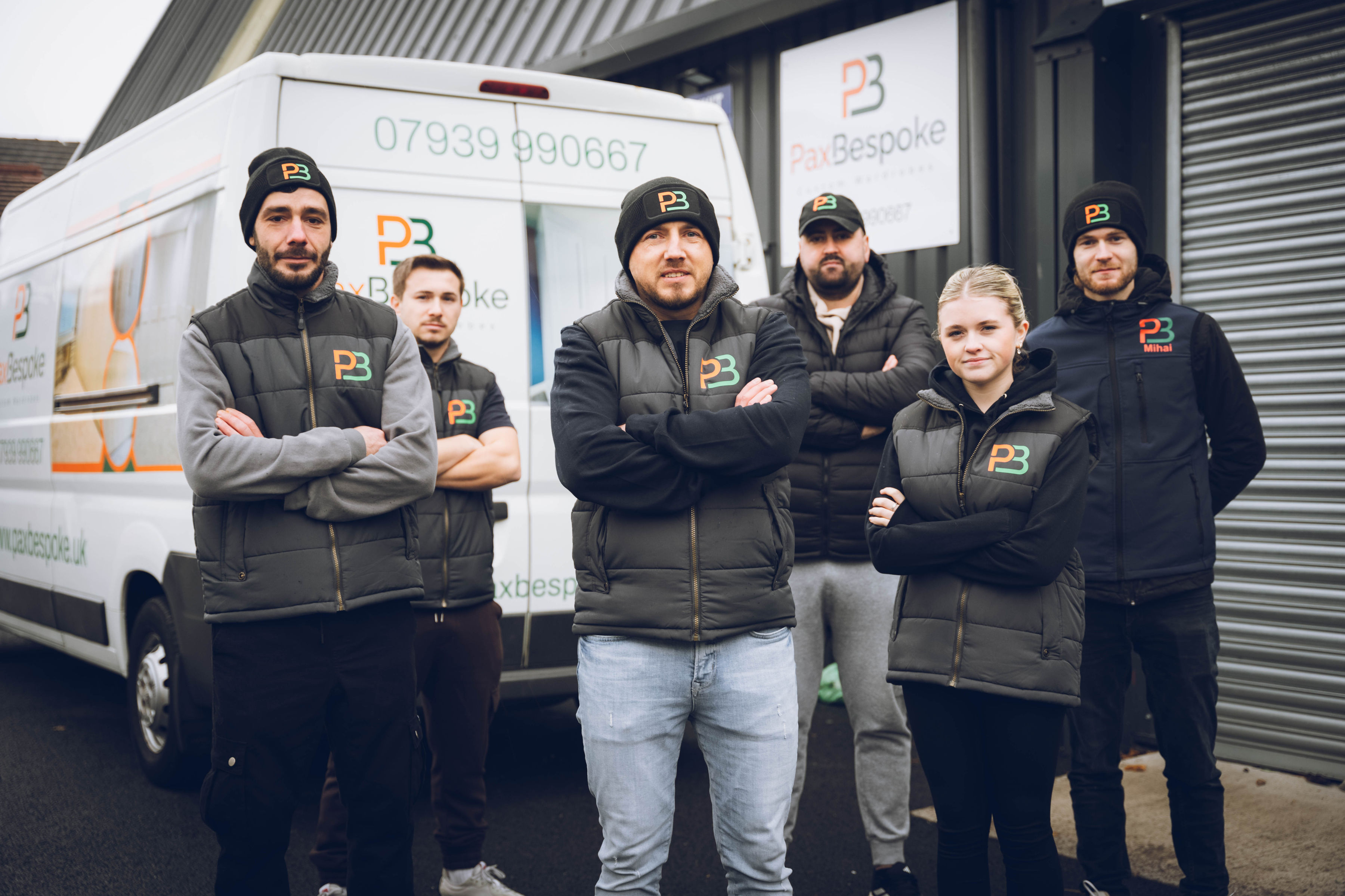 photo of the PaxBespoke team and a work van