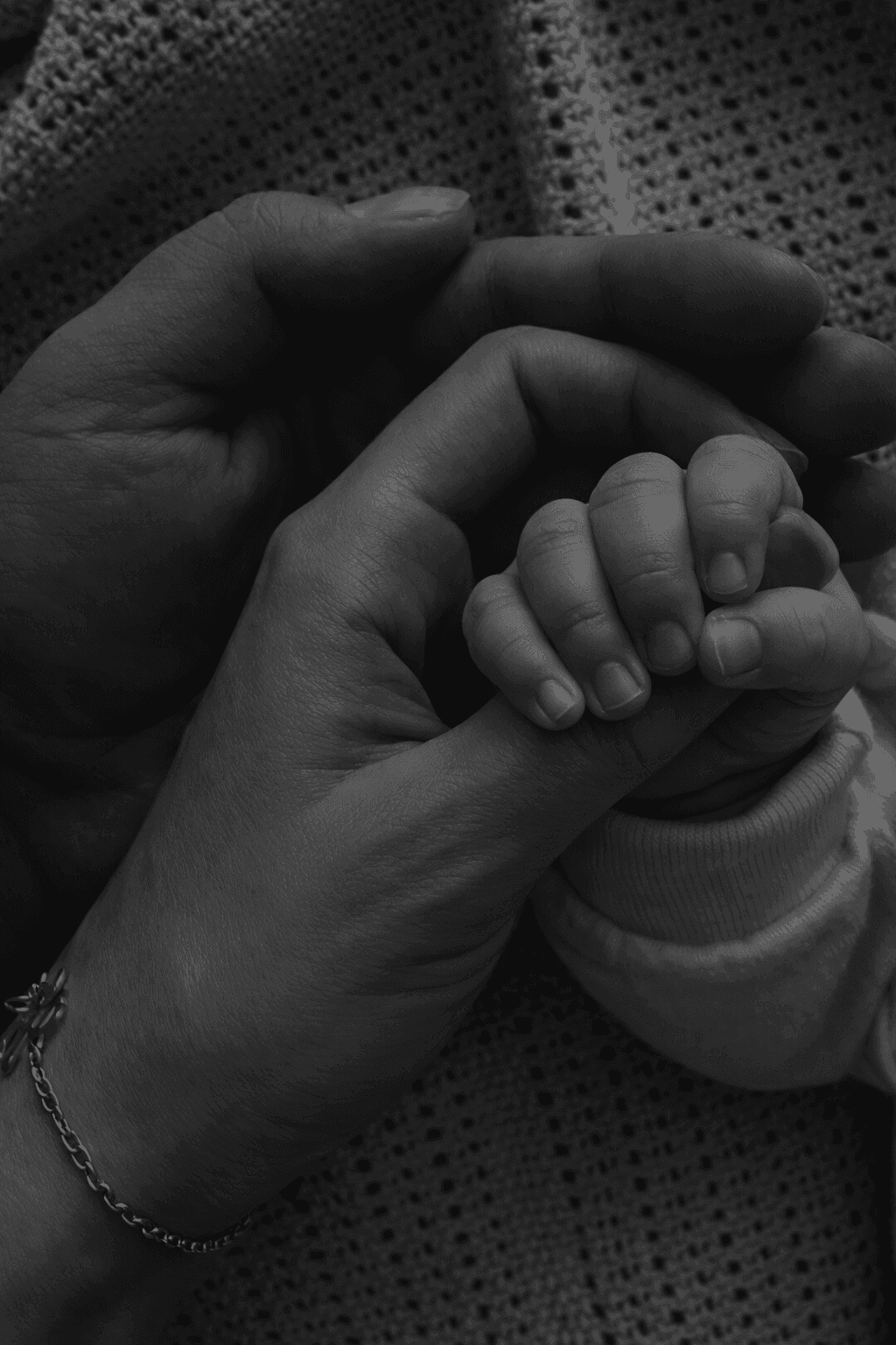 couple and baby hands