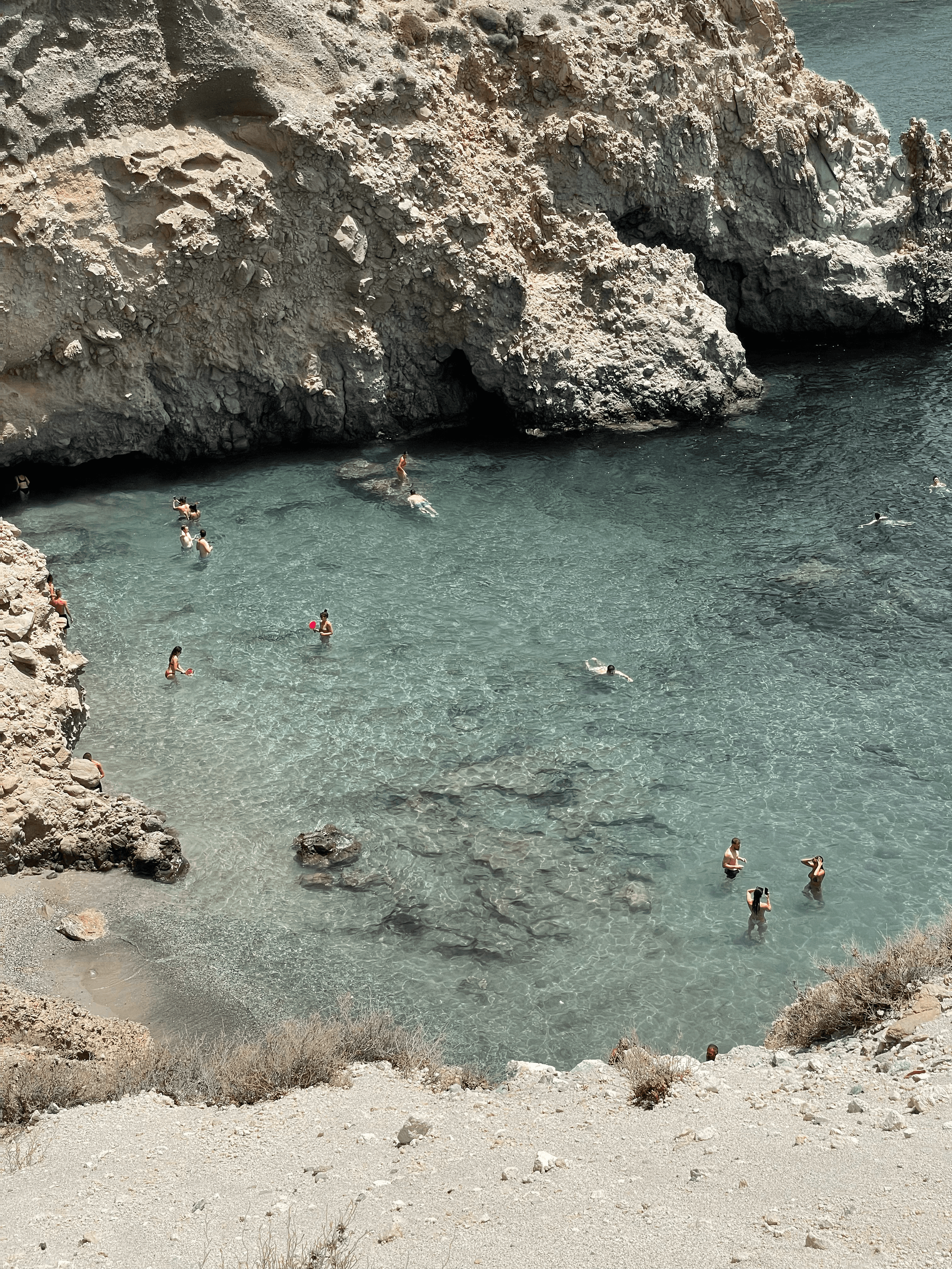 kids lying on a glass land and smiling
