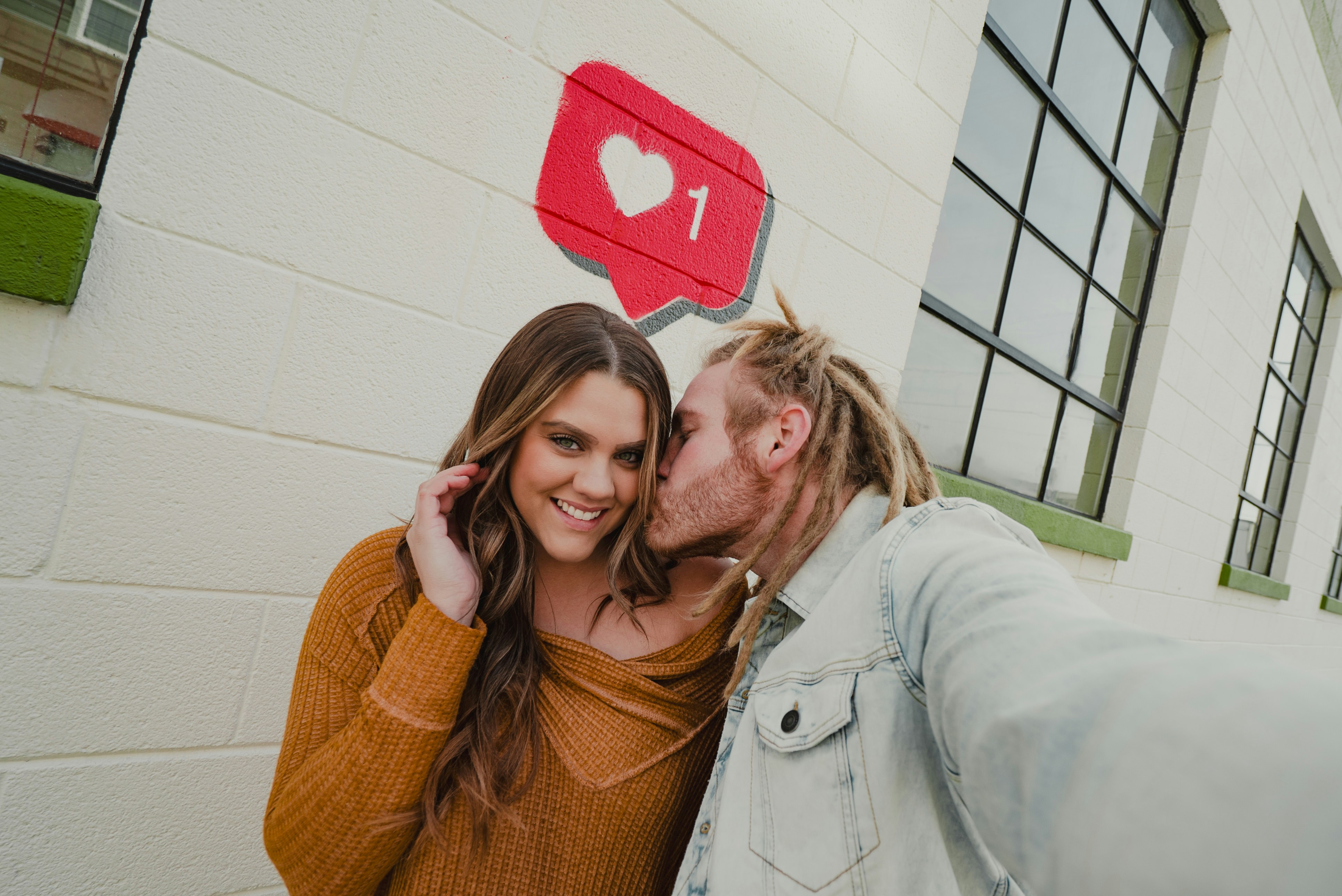 Couple having cute moment with a social media like
