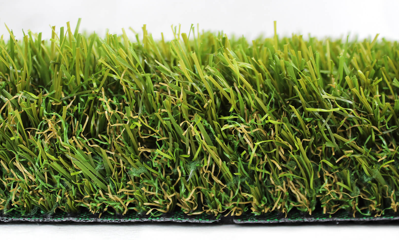 A close-up section displays AGL Grass North's Majestic 70 artificial turf, which shows its 2 1/2-inch pile height.