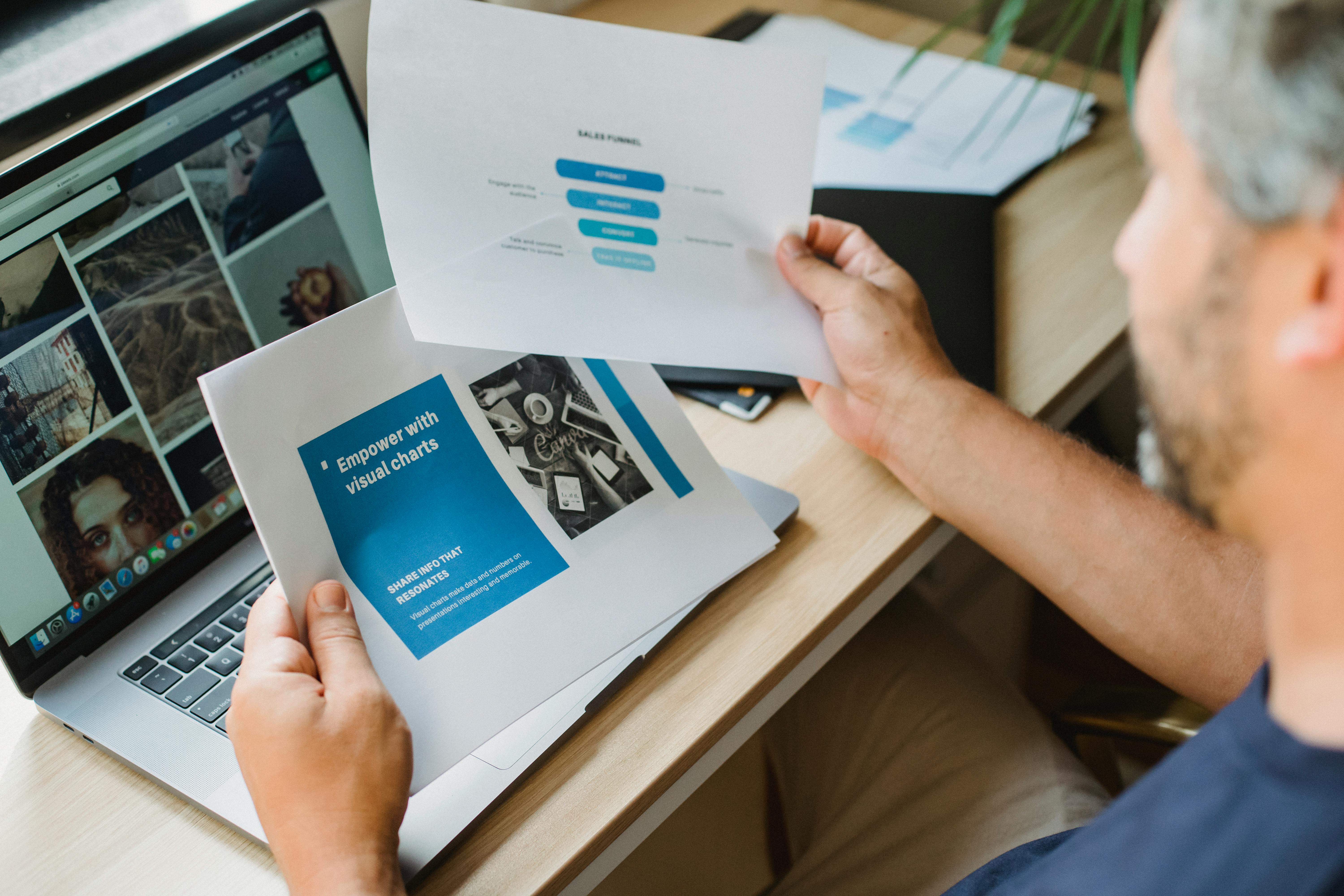 Over-the-shoulder view of a man studying interactive website elements in Brisbane