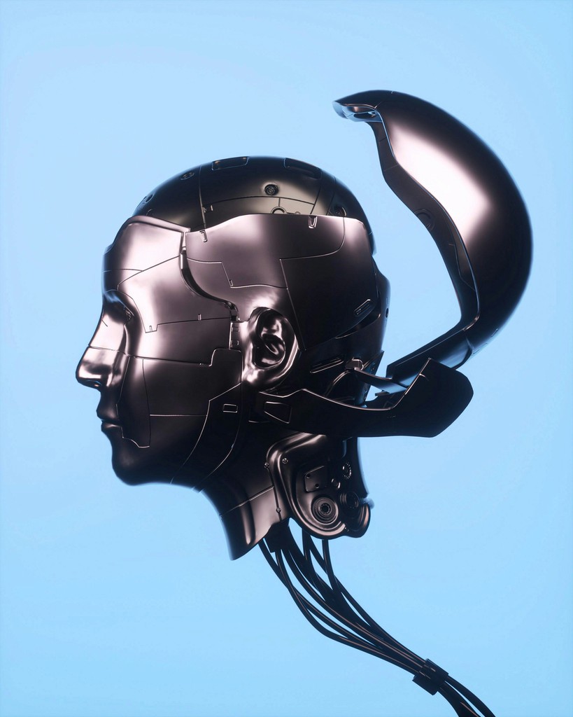 A futuristic image of a metallic humanoid head with an open, hinged cranium, revealing complex internal mechanisms, symbolizing advanced robotics and artificial intelligence.