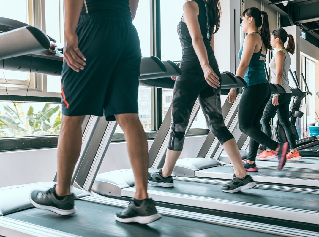 shot of a man’s legs trying to lose weight by walking on a treadmill in a gym