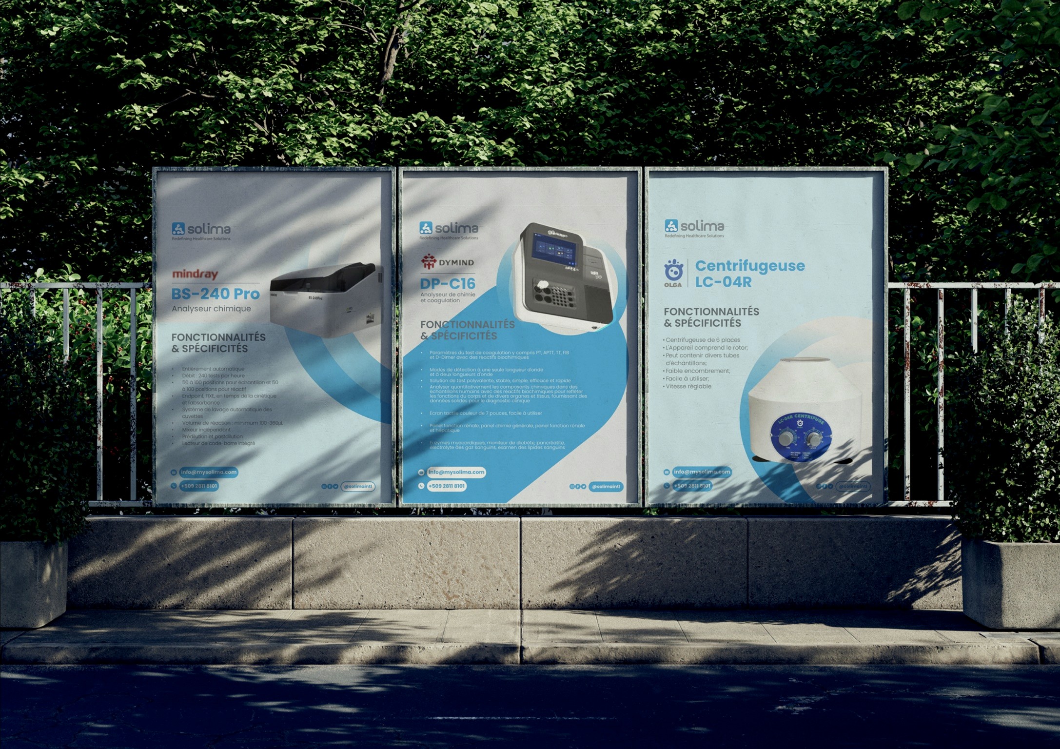 Outdoor ads for scientific equipment surrounded by greenery.