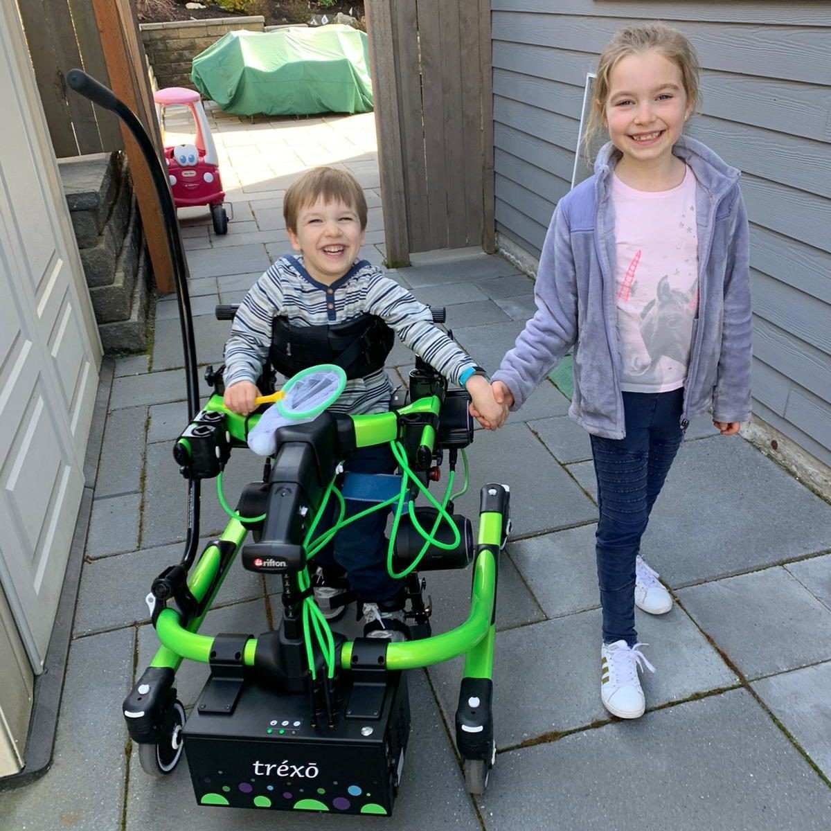 A child using assistive technology to walk
